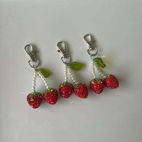 "\"Berry Cherries\" 🍒🍓 Cute rhinestoned strawberry charms with imitation pearl stems and a glass leaf 🍀 perfect bling for your bags <3 3 inches long, handmade with stainless steel hardware  CHARM CARE - Please keep in mind that all of my phone charms are intended to be used as an accessory and not to hold your phone - Excessive pulling on phone charms may result in breakage. - I am not responsible for any charms that break while in your possession  🍓IMPORTANT SHIPPING INFO - Please double check you have left the correct shipping address as I cannot accept returns or refunds due to an invalid address. If I can see that your address is invalid I will message you first to clarify." Strawberry Y2k, Diy Bag Charm, Cherry Keychain, Wire Charm, Cherry Charm, Strawberry Charm, Planner Charms, Phone Charms, On Phone