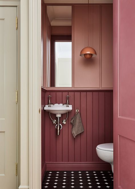 Prewar Bathroom Remodel, Wallpaper Paneling Ideas, Retro Small Bathroom, Trim In Bathroom Wall, Heidi Callier Bathrooms, Pop Of Color In Bathroom, Pink And Maroon Bathroom, Walls Trim Same Color, Rust Colored Bathroom Walls