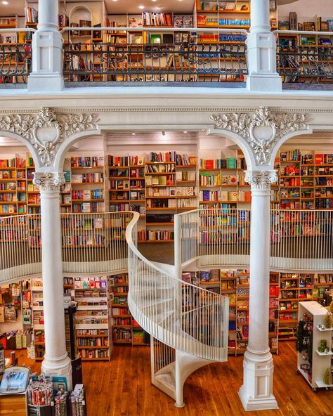 I adore bookstores I really do but this bookstore in Bucharest named Carturesti is one of the finest Ive ever been to. The colourful books juxtapose the clean white pillars and staircases and its both a book lovers dream and a photographers playground. Home Library Room, Awesome Bookshelves, Home Library Ideas, Home Library Rooms, Cool Bookshelves, Dream Library, Beautiful Library, Library Room, Cities In Europe