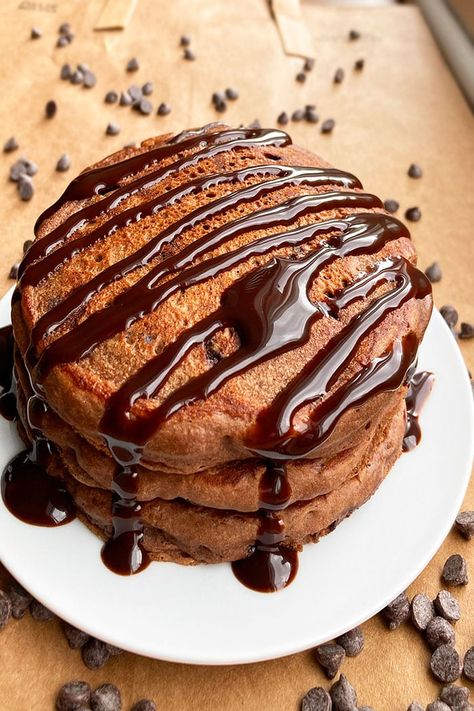 Quick, easy, soft, fluffy chocolate pancakes recipe, homemade with simple ingredients. They are full of cocoa powder, shredded chocolate, hot fudge sauce. These are so much fun for special occasion breakfasts such as birthdays, Mother's or Father's Day, or even showers that are brunch themed. I love the intense cocoa flavor of these pancakes making chocoholic dreams come true first thing in the morning. These Chocolate Chip Pancakes {With Chocolate Syrup} and Mocha Pancakes With Mocha Syrup are Chocolate Pancakes With Cocoa Powder, Pancakes Recipe Homemade, Chocolate Pancake Recipe, Brunch Ring, Mocha Syrup, Pancake Dippers, Chocolate Pancake, Homemade Pancake Recipe, Pumpkin Cream Cheese Muffins