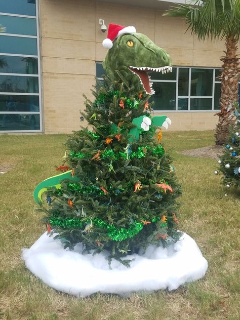 Inspired by my son's dinosaur obsession. I created the arms and tail using cardboard and foam sheets. Dino Themed Christmas Tree, Dinosaur Theme Christmas Tree, Dinosaur Themed Christmas Tree, Dinosaur Christmas Tree Ideas, Jurassic Park Christmas Tree, Dino Christmas Tree, T Rex Christmas Tree, Boy Christmas Tree, Dinosaur Christmas Decorations