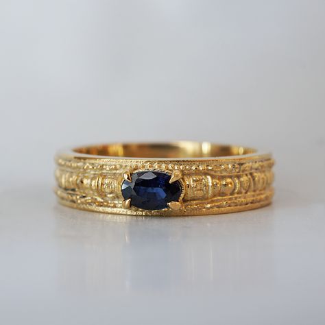 Introducing our distinguished Men's Egyptian Blue Sapphire Ring, a timeless symbol of strength and sophistication inspired by the captivating textures of nature found in the land of ancient Egypt. At its center gleams a majestic natural blue sapphire, reminiscent of the deep azure hues of the Nile River as it winds its way through the Egyptian landscape where the Pharoahs once walked. Set against a backdrop of rich, textured metal, the sapphire exudes an aura of power and mystique, capturing the Ancient Egyptian Rings, Mens Gold Rings Vintage Antique Jewelry, Men Signet Wedding Ring, Mens Engraved Rings, Male Signet Ring, Vintage Mens Jewelry, Blue Gold Ring, Men's Engagement Rings For Him, Unique Men’s Wedding Rings