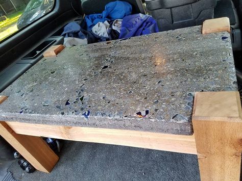 This table is made of a 2" thick concrete top with embedded glass. The top was polished to expose the glass and aggregate of the concrete. The base is made of rough sawn cedar 4x4 for the legs and 2x4 for the frame. The top was polished to 800 grit for a smooth finish. Dimensions are 36" long x 21" wide x 18" tall at the concrete top. Wood And Cement Table, Diy Garden Table, Concrete Table Top, Cement Table, Concrete Countertops Kitchen, Concrete Bench, Concrete Counter, Concrete Diy Projects, Reclaimed Wood Projects