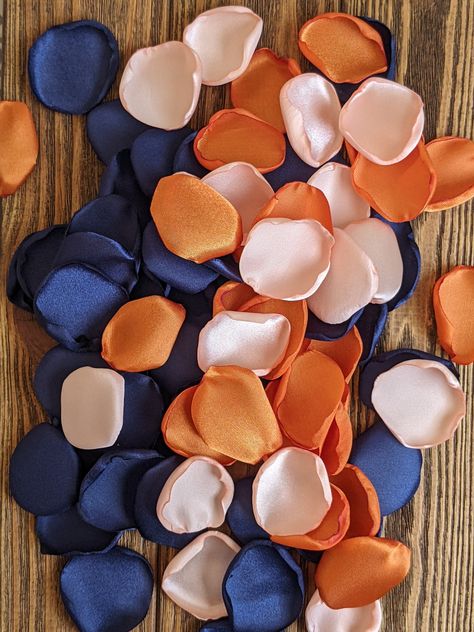 "🌸Reusable🌸 Inexpensive, affordable, fresh looking appearance, low maintenance, easy to clean, hassle and allergen-free, and 100% venue friendly🌸 The colors included in the listing for these flower petals are navy, burnt orange, and peach. Custom orders are always welcomed :) You can add or remove colors from the listing. Just add a note to me in the personalization space to do so. Brides are choosing this combination of colors in rose petals for their wedding and bridal shower decor; to fill Navy And Orange Wedding Decor, Navy And Burnt Orange Wedding, Burnt Orange And Navy Blue Wedding, Navy And Peach Wedding, Bright Orange Wedding, Navy And Orange Wedding, Orange And Blue Wedding, Rose Petals For Wedding, Rose Petals Falling