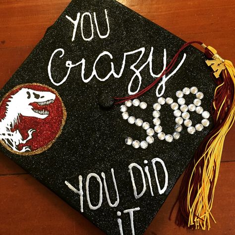 Pretty proud of the Jurassic Park cap I made for graduation! Jurassic Park Graduation Cap, Dinosaur Graduation Cap, Dinosaur Graduation, Senior Night Posters, Graduation Hats, College Graduation Cap Decoration, Nursing School Graduation, Grad Caps, Cap Decoration