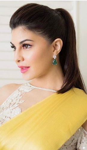 Jacqueline with a simple and chic high ponytail hairstyle that is perfect for medium wavy hair. a small and tiny high puff near the crown of her head adds to the overall charm of her look. Saree With Ponytail, Ponytail Hairstyle On Saree, Ponytail On Saree, Pony With Saree, Ponytail For Saree Look, Ponytail Hairstyles For Saree, Straight Hair Ponytail Ideas, Hair Puff Styles, Side Puff Hairstyles