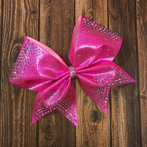 "This stunning hot pink rhinestone cheer bow has different size rhinestones along the top loops. Shown in hot pink with AB crystals.  This bow is currently available in any fabric color with your choice of rhinestones.   Badda Bling Bows provides the highest quality bows on the market specializing in cheer bows, practice bows, competition bows, softball bows, dance bows, rhinestone bows, school bows, sideline cheer and team bows.  We also uniform match.   - FREE SHIPPING on all team orders. - Ma Dance Competition Hair, Dance Team Uniforms, Sideline Cheer, Competition Bows, Dance Bows, School Bows, Softball Bows, Competition Hair, Bling Bows