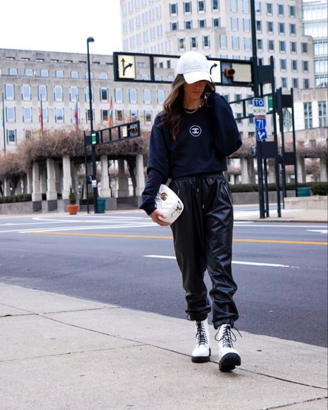 ✨If you watch Pop🍾Talks (on my stories) this sweatshirt from @moremgmemories should look familiar. 😎 I’m now able to link it! Goes perfectly with these leather joggers and white combat boots, don’t ya think?! ✨POP🍾TALKS: Feeling a bit whiplashed 🤪 from all this #Kimye breakup drama! Watch stories! http://liketk.it/35oTm #liketkit @liketoknow.it #LTKunder50 #LTKsalealert #LTKshoecrush Leather joggers Leather leggings Chanel sweatshirt, white combat boots, Chanel inspired bag, white baseba White Leather Joggers Outfit, Joggers Combat Boots Outfit, Joggers With Combat Boots, Joggers And Combat Boots Outfit, Joggers Outfit With Boots, Boots With Joggers Outfit, Black And White Combat Boots Outfit, White Combat Boots Outfit Fall, How To Style White Combat Boots