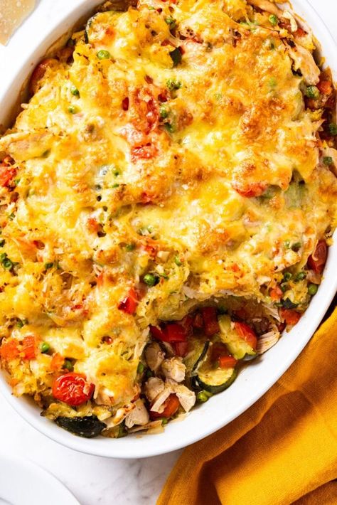 Instead of stuffing each spaghetti squash with a filling, this casserole incorporates everything into one easy baking dish. A combination of spaghetti squash, tomatoes, zucchini, and chicken are all mixed together and topped with cheese. Once baked, it’s the perfect, hearty meal for a weeknight or special occasion! | wyseguide.com #casserole #dinner #chicken #recipe #winter Squash Chicken Casserole, Wyseguide Recipes, Wyze Guide, Eyes Guide, Spaghetti Squash Chicken, Kaleb Wyse, Squash Spaghetti, Dinners Ideas, Wyse Guide