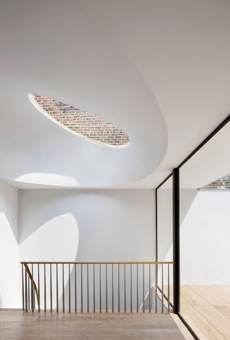 Two curved skylights top Oculi House by O' Neill Rose Architects Skylight Detail, New York Brownstone, New York Townhouse, Manhattan Apartment, Light Wood Floors, Attic Spaces, Multi Family Homes, Black Cabinets, Ceiling Windows