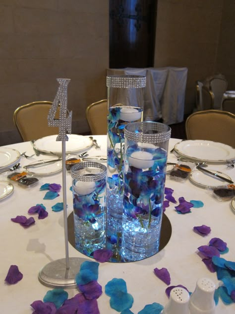 teal and purple wedding. teal and purple centerpiece. Royal Blue And Purple Wedding Theme Table Settings, Royal Blue And Purple Wedding Theme Wedding Ceremony Decor, Blue And Purple Wedding Table, Purple And Teal Wedding Ideas, Purple And Turquoise Wedding Ideas, Blue And Purple Wedding Theme, Teal Wedding Centerpieces, Turquoise And Purple Wedding, Magenta Wedding Decorations