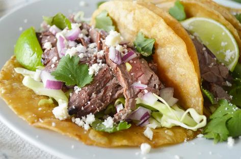 Arrachera Tacos - Marisa Home | Recipe Arrachera Tacos, Fried Corn Tortillas, Marinated Skirt Steak, Homemade Tamales, Delicious Steak, Fried Corn, Cotija Cheese, Steak Marinade, Burrito Bowl