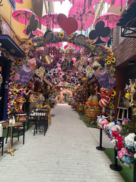 alice in wonderland themed decorations lining a path Alice In Wonderland Restaurant, Anime Theme Restaurant, Wonderland Restaurant, Alice's Restaurant, Alice In Wonderland Chandelier, Wonderland Chandelier, Athens, Seating Area, Alice In Wonderland