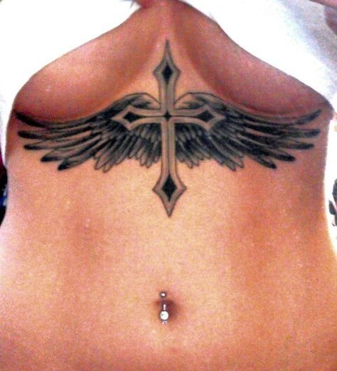 Cross & Wings Tattoo Woman Chest Tattoo Design, Cross On Stomach Tattoo, Cross On Chest Tattoo Woman, Cross Between Chest Tattoo, Cross With Wings Tattoo For Women, Cross Sternum Tattoo Women, Cross With Wings Tattoo Designs, Cross On Back Tattoo, Wings Tattoo On Chest