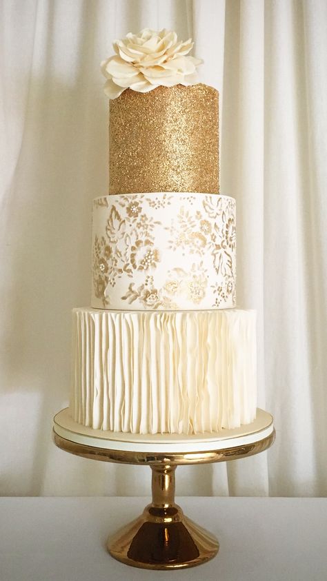 Stunning textured 24carat gold top tiered wedding cake with hand painted detailing. White And Gold Three Tier Cake, 2 Tier Gold Birthday Cake, White And Gold Two Tier Cake, Golden Jubilee Cake, Cakes White And Gold, Cake Catalogue, Textured Buttercream Cake, Gold Wedding Cakes, White And Gold Cake