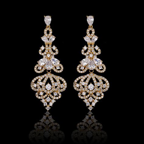 Our Lush Chandelier Earrings are a gorgeous accessory. They're long, detailed with crystal dangles to resemble the ornate finial of a chandelier. Pair these striking earrings with a date night dress and watch heads turn as you walk into the room. Premium Materials - Made from authentic gemstones & nickel-free metal Jewellery Sketch, Antique Luxury, Chandelier Earring, Diamond Chandelier Earrings, Diamond Chandelier, Bridal Earrings Chandelier, Gold Chandelier Earrings, Date Night Dress, Gold Mangalsutra Designs