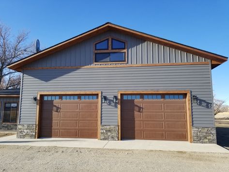 EDCO's Charcoal Gray metal siding looks beautiful with natural wood trim. This exterior color combination is perfect for garages and sheds! Discover more at edcoproducts.com. Shed Home Exterior Colors, Gray And Black Metal Building, Dark Gray Metal Building, Wood Look Metal Siding Exterior, Exterior Metal Siding Shop With 2nd Color For Oddice Afdition, Steel Siding Colors, Steel Siding That Looks Like Wood, Metal Siding Colors, Metal Shingle Roof