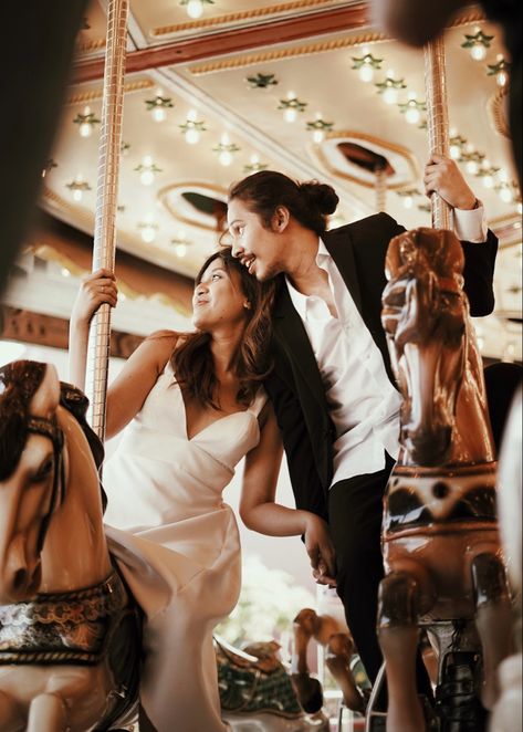 Carnival Pre-wedding at Dufan Indonesia with suite and white dress. Wedding Carousel, Carousel Photoshoot, Couple Photoshoot, Engagement Photo Inspiration, Wedding Photoshoot, Couples Photoshoot, Engagement Shoots, Carousel, Aesthetic Art