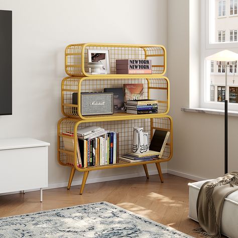 This modern golden style meshes standing etagere bookshelf with an original design defined by steel branches into any room in the house. The contrast between the top's broad lines and the structure's longitudinal threads creates an extra visual impression. It may be used as a bedside table as well as a set of floating shelves. The open display mesh standing etagere bookshelf provides storage, attractiveness, and elegance. The framed photographs, office supplies, or other ornamental knick-knacks Urban Outfitters Shelf, Bedroom Setup, Framed Photographs, Interior Deco, Home Room Design, Apartment Interior, Knick Knacks, Apartment Living, New Room