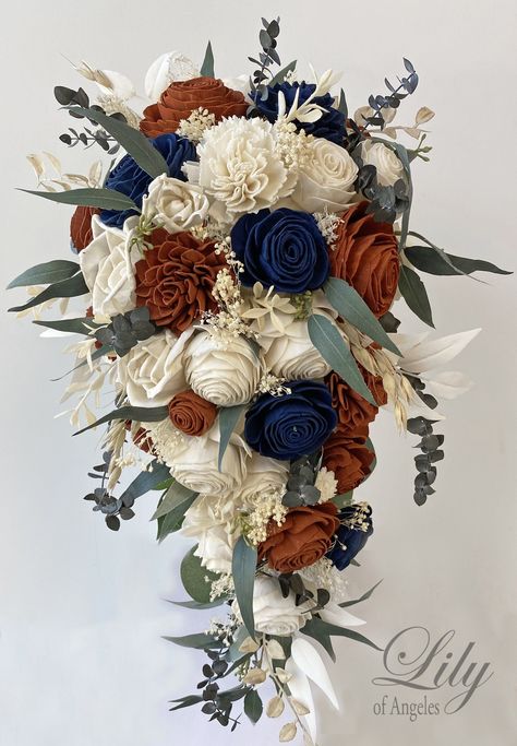 "Model SBNV01 ABOUT THIS ITEM: This wedding flower package is made with natural Sola flowers, Rust (Burnt Orange), Navy and Ivory Roses, Mini Roses, Beli Flowers, Dried Baby's breath, Faux Greenery and Faux Berries. The handle is decorated with Ivory ribbon. Bride's bouquet shown in 1st picture is Cascade 9-10\" by 17-18\". Bride's bouquet shown in 2nd picture is the 10\" size. Only bride bouquet is cascade in this model, Other bouquets are all round (not cascade). ABOUT SOLA FLOWERS: Sola wood Wedding Bouquet Cascade, Navy Wedding Bouquet, Bouquet Cascade, Cascade Bridal Bouquet, Flower Fall, Rusting Wedding, Cascading Bridal Bouquets, Cascading Wedding Bouquets, Burnt Orange Weddings