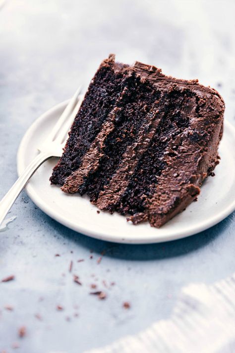 Three layers of moist and rich chocolate cake. This cake is frosted with a delicious triple chocolate buttercream. Recipe via chelseasmessyapron #moist #recipe #fromscratch #chocolate #cake #birthday #best #homemade #ideas #frosting 3 Layer Chocolate Cake Recipe, Layer Chocolate Cake Recipe, 3 Layer Chocolate Cake, Chocolate Cake Recipe From Scratch, Paleo Chocolate Cake, Cake Recipe From Scratch, Layer Chocolate Cake, Triple Chocolate Cake, Amazing Chocolate Cake Recipe