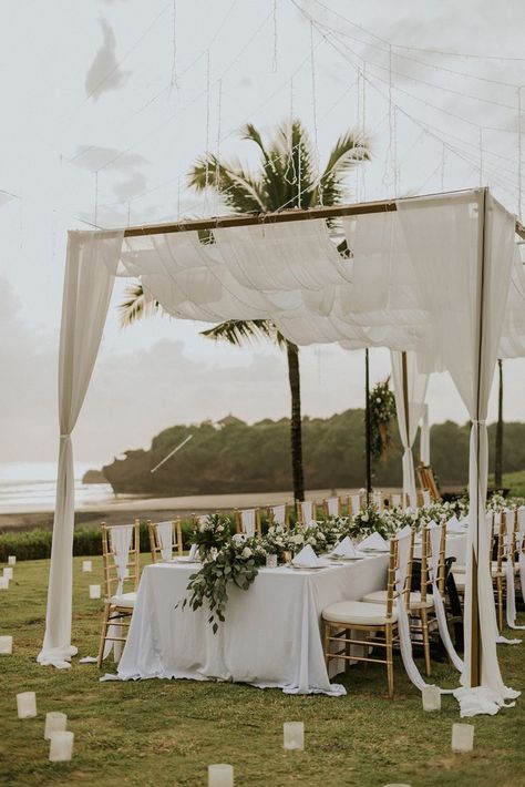 Gorgeous Bali wedding reception decor idea. How romantic is that canopy with the fairy lights! View Jillian and Daniel's full Bali wedding feature on SingaporeBrides! Beach Reception Decorations, Beach Wedding Decorations Reception, Wedding Setup, Beach Wedding Centerpieces, Beach Theme Wedding Invitations, Beach Wedding Reception, Beach Wedding Flowers, Elegant Wedding Reception, Beach Wedding Decorations