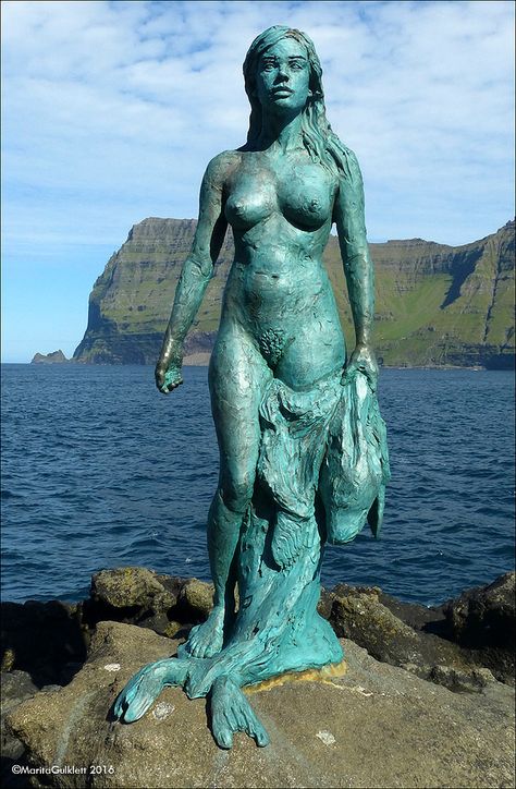 This 9 ft bronze statue of Kópakonan (The Seal Wife) was installed in the Mikladalur Harbor on Kalsoy, one of the Faroe Islands, on August 1st, 2014. Mermaid Sculpture, Mermaid Statues, Futuristic Art, Faroe Islands, World Best Photos, Bronze Statue, Folk Tales, Mauritius, Art Inspo