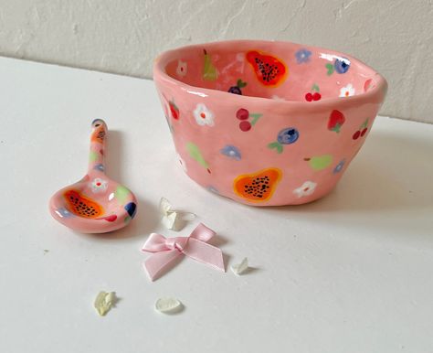 a hand pinched, hand painted stoneware ceramic bowl, with a matching spoon handmade with love 🤎 so some small imperfections possible Fun Ceramic Bowls, Pottery Small Bowls, Fruit Painted Pottery, Hand Painted Bowl, Bowl Pottery Painting, Ceramic Bowl Painting, Ceramic Bowl Painting Ideas, Painted Ceramic Bowl, Whimsical Pottery