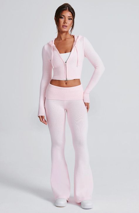 The Portia Knit Pants are a must-have for any wardrobe. These versatile pants feature a flattering fit and flare silhouette, with a wide rib waistband for added style. Complete the look with the matching Portia knit hoodie.     Colour: Pink.  Regular length.  Unlined.  Fit and flare silhouette.  Wide 2x2 rib waistband.  Fold over waistband detail.  Internal elastic in waistband.  Model is an XS and is wearing an XS.   Size: XS, S, M, L, XL, XXL Knit Pant Set, Knit Pants Set, Light Pink Flare Leggings, Cute Sets Two Pieces, Matching Set Pants, Cute Lounge Wear, Pink Matching Set, Pink Two Piece Set, Homecoming Dresses Corset