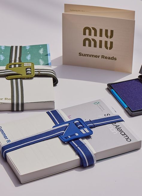 Miu Miu Summer Reads | Miu Miu Miu Miu Packaging, Miu Miu Summer, Coffee Bakery, Paris Seine, Paper Carrier Bags, Summer Reads, Merch Ideas, Beach Wear Dresses, Leather Shirt