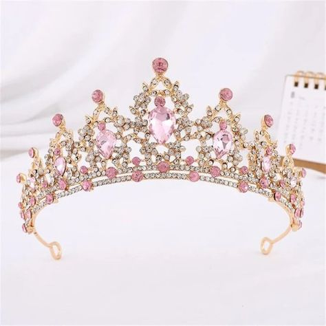 Step into a world of elegance with our Pink Rhinestone Tiara Crown. Exquisitely designed for the modern-day princess, this crown is a blend of charm and sophistication, perfect for weddings, pageants, and special occasions. Each crown is meticulously handcrafted from high-quality alloy, ensuring a lightweight yet durable frame. Adorned with radiant artificial crystals and shimmering rhinestones, it catches the light from every angle, promising to keep all eyes on you. The romantic pink hue of the crystals adds a whimsical touch to any outfit. Whether it's your big day or you're gracing a formal event, this tiara will complement your ensemble with its enchanting allure. Designed with comfort in mind, the tiara sits snugly atop your head with two combs that secure it in place, ensuring you c Prom Tiaras, Crystal Crown Tiaras, Birthday Tiara, Party Hair Accessories, Silver Tiara, Pink Crown, Rhinestone Tiara, Princess Tiara, Bridal Hair Jewelry