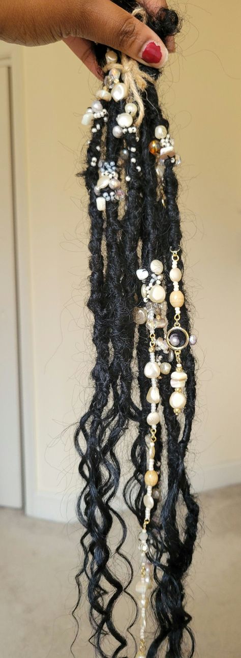 Handcrafted boho locs adorned with pearl charms, beads and etc.  ~Synthetic hair with synthetic hair ends (Color 1 ) ~72 locs in total and 12 of them are accent pearl accent locs. ~The locs are around 19-20 inches My recommendation installing the accent locs are the soft loc method. Where you take your braid and loop it through the loc hole and crochet the end of your braid through the root or couple inches down your braid.  *Note: Each Crochet Locs is handmade and may vary slightly in texture a Bohemian Braid Styles, Locs With Charms, Locs With Accessories, Fairy Locs, Faux Locks, Boho Locs, Color Contour, Flat Iron Hair Styles, Short Locs Hairstyles