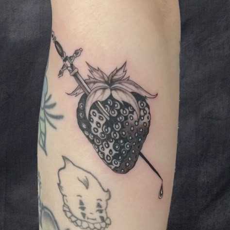 black and grey fine line tattoo of a strawberry with a delicate sword through it done by @ pain_transmutation in Chicago, IL Strawberry Tattoo Black And White, Strawberry Tattoo Design, Strawberry Tattoos, Masterpiece Tattoo, Sparkle Tattoo, Strawberry Tattoo, Knife Tattoo, Black Strawberry, White Strawberry