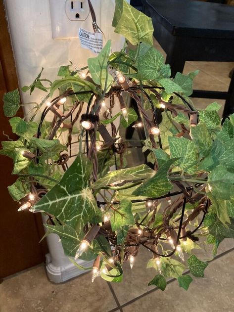 Wire Basket Ideas, Hanging Baskets Diy, Dollar Tree Flowers, String Of Lights, Hanging Flower Baskets, Green Garland, Basket Lighting, Inside Plants, Diy Outdoor Decor