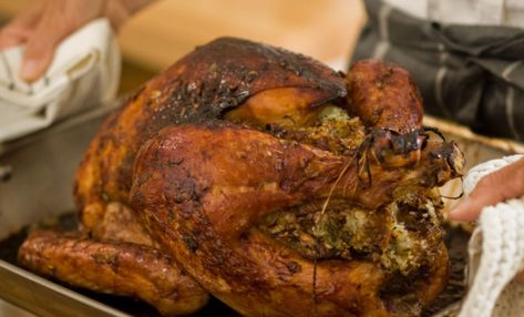 How about this recipe from MHP Grills?  BBQer CHOICE THANKSGIVING TURKEY WITH HERB STUFFING 12 pound turkey 12 oz. package herb seasoned stuffing mix 1 cup chopped onion 1 cup chopped celery 2 Tbs. butter 3 eggs beaten 1/2 cup chicken broth (or more) 4 to 5 handfuls wet wood chips (optional) Sticky Rice Stuffing, Asian Roast, Bbq Grill Recipes, Rice Stuffing Recipes, Asian Hot Sauce, Grill Tips, Recipes Grill, Whole Turkey Recipes, Rice Stuffing