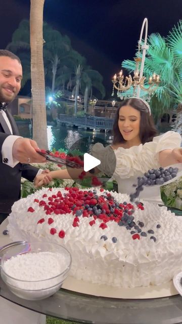 THE WEDDING BLISS on Instagram: "Not your ordinary wedding cake😍✨🤍 Bride: @Salma_Elgarhy Cake: @radwa_desserts Media coverage: @bling.weddings Venue: @ruyaclub Wedding Planner: @maison2luxe.eg Dress designer: Maii.elgallad Photog: @abdallah_mohamed_x Videographer: @xfilmmaker Suit: @stile.eg Makeup Artist: @makeupbyshamss Hair: @eslaam.lomaa zaffah: @music.designers Audio guest book: @atthetone.eg Ushers: eliteinegypt Jerb: @bouquet_bride_by_nour_ali Mandeel: @nourgallery27_for_handmade" The Wedding Bliss, Bling Wedding Cakes, Audio Guest Book, Bouquet Bride, Media Coverage, Dress Designer, Guest Book, Wedding Cake, Wedding Cakes