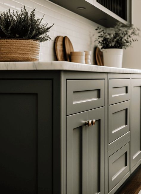 Find the best paint colors for kitchen cabinets with these 13 jaw-dropping color ideas! Picked from Benjamin Moore, Sherwin Williams and Farrow & Ball! Pewter Green Sherwin Williams Kitchen Cabinets, Benjamin Moore Painted Cabinets, Sw Olive Grove Cabinets, Best Island Paint Colors, Rainy Afternoon Benjamin Moore Cabinets, Millstone Gray Benjamin Moore Cabinets, Green Cabinets With Wood Island, Benjamin Moore Greens For Kitchen, Farrow And Ball Pigeon Color Match Sherwin Williams