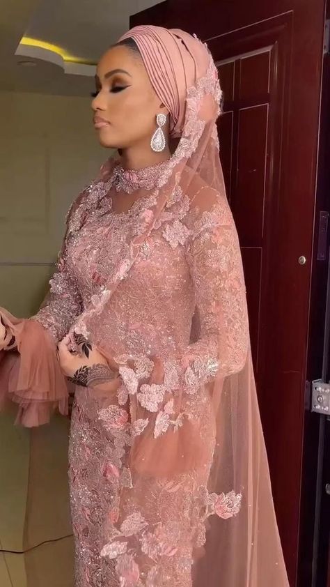 Hausa Lace Gown Styles - Gist94 Nigerian Nikkah Dress, Nigerian Lace Styles Dress Modest, Arewa Hausa Bridal Styles, Long Sleeve Nigerian Dress, Lace Gown Styles For Bride, Pink Nigerian Wedding Dress, Pink Asoebi Lace Styles For Wedding, Pink Nigerian Dress, Pink Lace Evening Dress