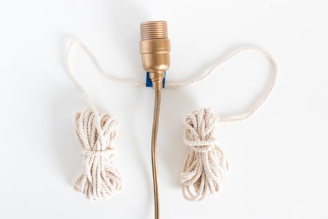 Make a simple, unique macrame wrapped wall light with a twisted cord in no time for a statement-making piece of decor. #["Curbly-Original", "How-To", "yarn & string", "minimalist", "living room", "Office & Workspace", "Entryway & Hall", "wall art", "Lamps & Lighting", "macrame", "paint", "DIY", "lighting", "rope", "string"] Hall Wall Art, Macrame Light, Junk Drawer Organizing, Unique Macrame, Entryway Hall, Simple Macrame, Art Lamps, Macrame Wall Hanging Diy, Cord Light