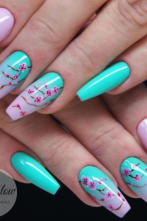 Springtime Bliss: Serene and stunning pastel pink and turquoise coffin nails adorned with delicate cherry blossom art, creating a mesmerizing ombre gradient. Embrace the essence of renewal and channel your inner charm! // Photo Credit: Instagram @indiglownails Cherry Bloom Nails, Spring Nail Designs Coffin Shape, Apple Blossom Nails, Ombre Nails With Flowers, Turquoise And Pink Nails, Sakura Nails Design, Pink And Turquoise Nails, May Nail Art, Nail Art Turquoise