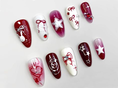 Introducing our Y2K Nail Set with Elegant Motifs, a captivating blend of nostalgia and modern flair that'll elevate your nail game to new heights! 💅✨ Transport yourself back to the iconic Y2K era with our meticulously crafted press-on nails, adorned with mesmerizing motifs that exude elegance and sophistication. Each nail boasts a stunning combination of red and white hues, infused with unique chrome designs that add a touch of futuristic charm to your manicure. 🔴🤍 Embrace the timeless allure of red and white, reminiscent of classic Y2K fashion trends that continue to captivate hearts today. 💫 Our elegant motifs draw inspiration from the essence of the Y2K era, combining retro vibes with a contemporary twist for a truly unforgettable look. 💅 Experience the convenience and versatility Nails Y2k Red, Uñas Y2k, Y2k Nail, Chrome Designs, Trendy Manicure, Nails Y2k, Perfect Manicure, Nails Today, Y2k Era