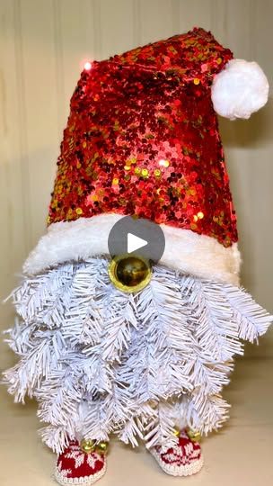 19K views · 237 reactions | Easy Santa Gnome Christmas Dollar Tree DIY | Easy Santa Gnome Christmas Dollar Tree DIY #dollartreediy  #christmasdiy #santadiy #christmascrafts #craftybeach | By Crafty Beach on YouTube | Hey guys this is Julie from
Crafty Beach on YouTube and I have a fun Christmas gnome
Dollar Tree DIY we're going to be using some of the booty
ornaments from Dollar Tree Santa hat and two Christmas
trees now the Christmas trees are going to be Santa's beard
so I chose white but you could always do it in green as well
you're going to need two of those and you don't really need
the stands but I thought they were cool so I thought I would
say them for another project what we're going to do is make
the beard out of the two trees together and we're actually
going to make this be a Gnome Dollar Tree, Christmas Dollar Tree Diy, Christmas Dollar Tree, Two Christmas Trees, Tree Gnome, Santa Gnome, Santa Beard, Dollar Tree Christmas, Two Trees