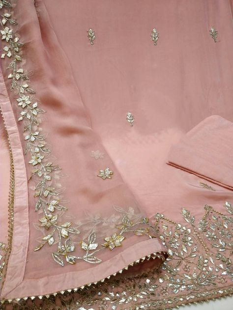 Item Overview ATHARVA Hand Embroidery Salwar Kameez/Pink Crepe Silk Shirt/Gota Patti Chiffon Dupatta/Custom Stitch Unstitch/Anarkali/Gift Dno. CH1839B Fabric: * Shirt - Crepe Silk- Hand Embroidered Neck 2.5 Mts - Beautiful Hand Embroidery * Dupatta: Chiffon Chinnon Dupatta- All over Exclusive Gota Patti Embroidery - 2.5 Mts- Latkans Tassels * Bottom Santoon Silk 2.5 Mts. Excusive Hand Embroidered Party Wear Punjabi Suit. Customization: * Fabrics Customization: Designs Can be made in different Fa Hand Work Embroidery Suits Salwar Kameez, Hand Work Embroidery Dupatta, Neck Line Embroidery Design, Handwork Dupatta, Mandira Wirk, Gota Patti Suits, Gota Embroidery, Dupatta Designs, Patiala Suit Designs