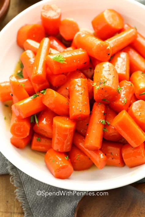 Glazed Carrots are made with a buttery brown sugar and maple glaze. They are a simple side dish that's absolutely bursting with flavor! #glazedcarrots #easyside #sidedish #spendwithpennies #maplecarrots Maple Glazed Carrots, Glazed Carrots Recipe, Honey Glazed Carrots, Honey Roasted Carrots, Spend With Pennies, Glazed Carrots, Carrot Recipes, Vegetable Side, Honey Recipes