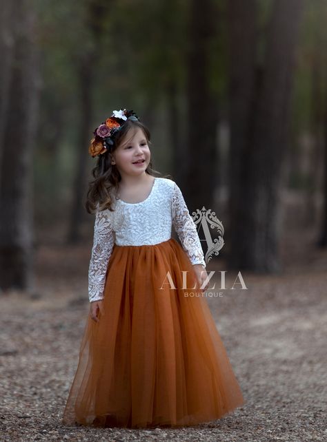 Burnt Orange  Lace Top Scalloped Edges Back Party Flower Girl Dress . This stunning lace gown will have all eyes on her! Features the lace V-back with lovely scalloped edges and soft flowy tulle skirt.    The lace used in the bodice is very soft and lined at the front with a stretch jersey cotton, making it comfortable against the skin. This dress is perfect for all occasions, family portraits, junior bridesmaids or flower girls, birthday parties and more. Pull-on styling; fully lined  This list White And Burnt Orange Flower Girl Dress, Flowergirls Dress Fall, Dark Teal And Rust Orange Wedding Groomsmen, Flowergirl Wedding Photos, Flower Girl Fall Wedding, Terracotta Flower Girl Dress, Burnt Orange Flower Girl Dresses, Western Flower Girl Dresses, Burnt Orange And Sage Green Wedding