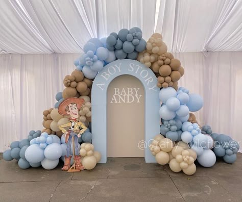 @crafty_wildflower_ on Instagram: "It’s A Boy Story!🚀📚💙 Congratulations to the parents to be! • • #babyontheway #babyshower #woody #toystoryparty #toystory #disney #itsaboy #babyshowerdecor #backdropdecoration #ballooninstallation" Toy Story Baby Shower Backdrop, Toys Story Baby Shower Ideas, Woody Baby Shower Theme, Disney Boy Baby Shower Theme, It’s A Boy Story Baby Shower Centerpieces, Boy Toy Story Baby Shower Theme, It’s A Boy Story Decor, Toy Story Themed Baby Shower (boy), Baby Shower Toy Story Theme