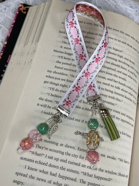 You will get one Bookmarks as pictured.The ribbon is 11.5 inches long not including the charms. -This is a Handmade bookmark out of ribbon and charms with accessories. They are adorable and would make the perfect gift for any BOOK LOVER in your life, or the perfect little treat for yourself ;) -I do not accept returns or exchanges but please contact me if there was an issue with your order or item.I will do my best to help or fix the issue. -Thank you again for your business. We Appreciate you just stopping by. Please leave a review it would really help us out  Enjoy <3 Bookmark Ribbon, Charm Bookmark, Bookmark Handmade, Stock Flower, Beaded Bookmarks, Quick Crafts, Flower Bookmark, Book Markers, Ribbon Bookmarks