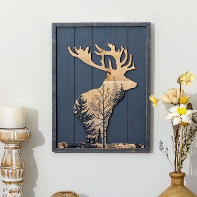 Add a dazzling wildlife touch to your home with this Forest Moose Wood Wall Decor. This rustic wood framed wall piece features a looking back moose silhouette with a natural color and black forest print on a gray wood plank background. Hang it up with other nature-inspired pieces for a fantastic look! | Millwood Pines Forest Moose Wood Wall Decor in Brown/Gray/Red, Size 15.75 H x 11.81 W x 0.98 D in | Wayfair | Home Decor Moose Paddle Decor, Woodworking Wall Decor, Rustic House Kitchen, Lake Home Decor, Lodge Wall Decor, Wood Pictures, Woodland Home Decor, Moose Silhouette, Rustic Wood Crafts