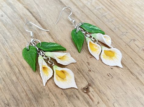 Calla Lily earrings, handmade, polymer clay, Sterling Silver and clip ons available Lily Flower Earrings, Orchid Clay Earrings, Polymer Clay Calla Lily, Lily Polymer Clay, Calla Lily Jewelry, Calla Lily Necklace, Applying Perfume, Lily Jewelry, Lily Earrings