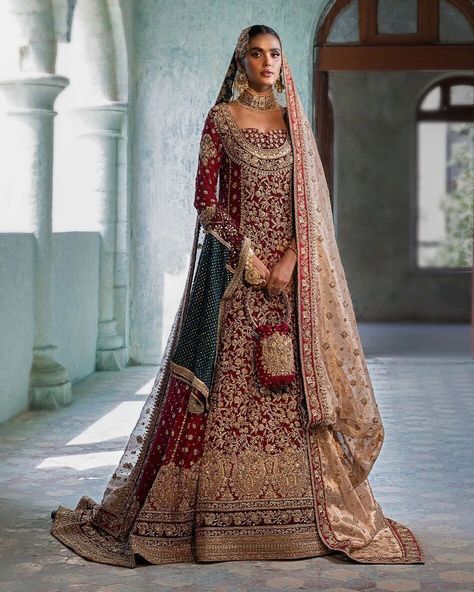 This vibrant red gown is a masterpiece of delicate handcrafting, showcasing meticulous attention to detail. The embellished neckline, adorned with gold kora, dabka, sequins, and kundan, sets the tone for the exquisite floral jaals that follow, richly accentuated with intricately crafted borders in a gold zardozi palette. The sleeves are further enhanced with a delicate bunch and small motifs, finished with hand-embellished borders. The back trail, with its embellished border details, adds an ... Small Motifs, Zainab Chottani, Embellished Neckline, Lehenga Skirt, Asian Bridal, Red Gowns, Dress Boutique, Luxury Bridal, Boutique Online